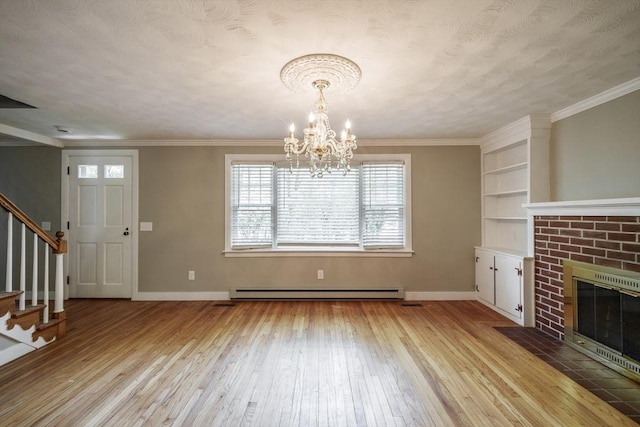 313 Bennett Rd, Hampden, MA 01036 - unfurnished living room with light wood finished floors, stairway, a chandelier, a brick fireplace, and baseboards
