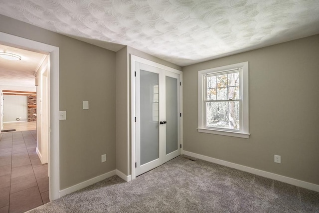 313 Bennett Rd, Hampden, MA 01036 - unfurnished room with baseboards, tile patterned floors, and carpet floors
