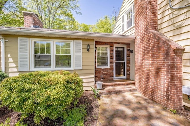 313 Bennett Rd, Hampden, MA 01036 - property entrance with a chimney