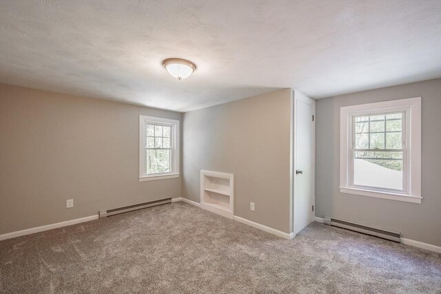 313 Bennett Rd, Hampden, MA 01036 - unfurnished room with a baseboard radiator, healthy amount of natural light, and carpet flooring