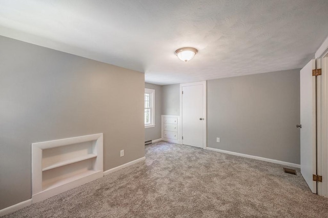 313 Bennett Rd, Hampden, MA 01036 - unfurnished bedroom featuring carpet flooring, baseboards, and baseboard heating