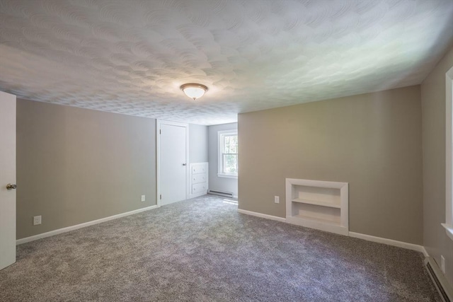 313 Bennett Rd, Hampden, MA 01036 - carpeted spare room with a textured ceiling, baseboard heating, baseboards, and built in features