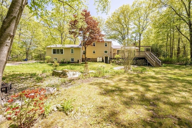 313 Bennett Rd, Hampden, MA 01036 - view of grassy yard with stairway and a deck