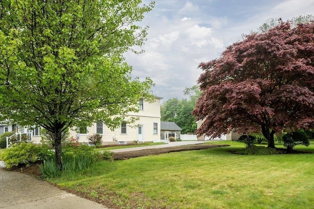 view of home's exterior featuring a yard