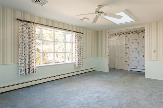 empty room featuring a baseboard radiator, visible vents, and wallpapered walls