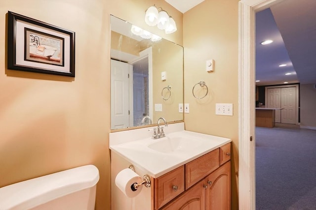 bathroom with vanity and toilet