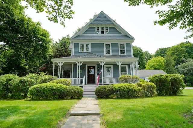 70 Main St, Northborough, MA 01532 - victorian house with a front yard and covered porch