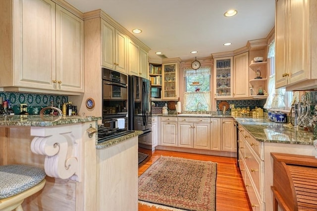 70 Main St, Northborough, MA 01532 - kitchen with a sink, black appliances, a peninsula, decorative backsplash, and recessed lighting