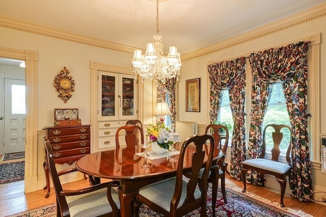 70 Main St, Northborough, MA 01532 - dining room featuring a chandelier, light wood-style flooring, and ornamental molding