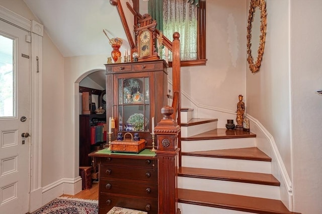 70 Main St, Northborough, MA 01532 - stairs with wood finished floors, arched walkways, lofted ceiling, and baseboards