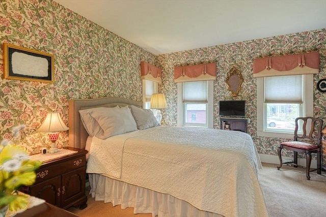 70 Main St, Northborough, MA 01532 - bedroom with wallpapered walls, multiple windows, and light colored carpet
