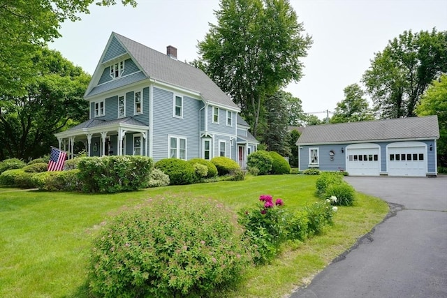 70 Main St, Northborough, MA 01532 - view of side of property featuring a chimney, a yard, and a garage