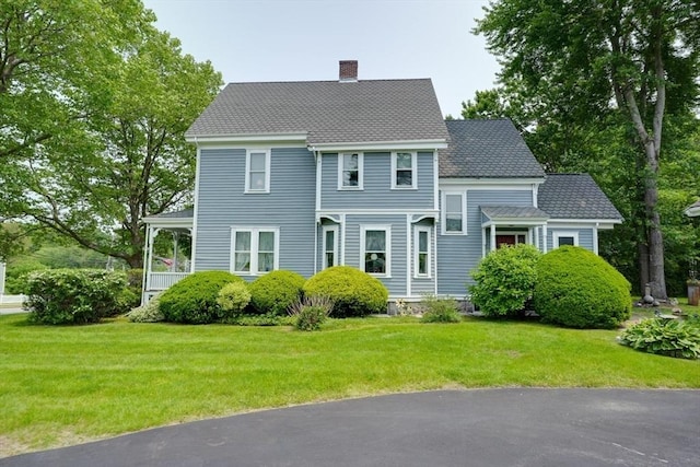 70 Main St, Northborough, MA 01532 - view of front of home featuring a chimney and a front lawn