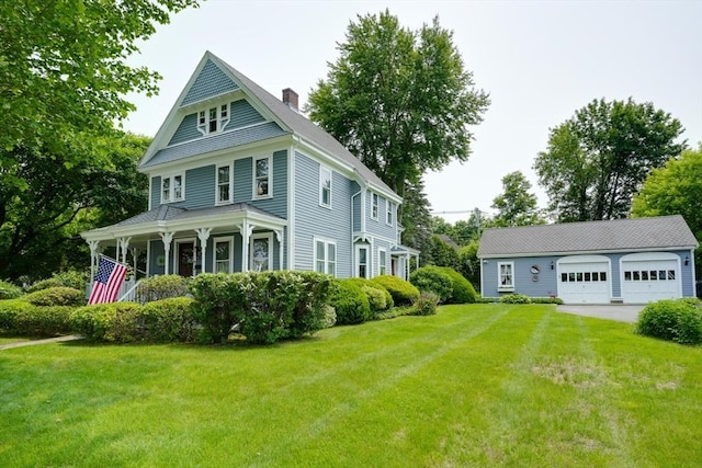 70 Main St, Northborough, MA 01532 - view of front of property with a chimney, a detached garage, a front yard, and covered porch