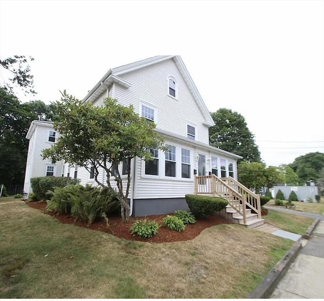 56 Vernon St, Whitman, MA 02382 - view of front facade featuring a front yard