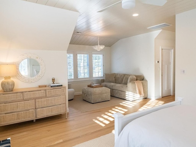 bedroom featuring light wood-type flooring, wood ceiling, lofted ceiling, and ceiling fan with notable chandelier