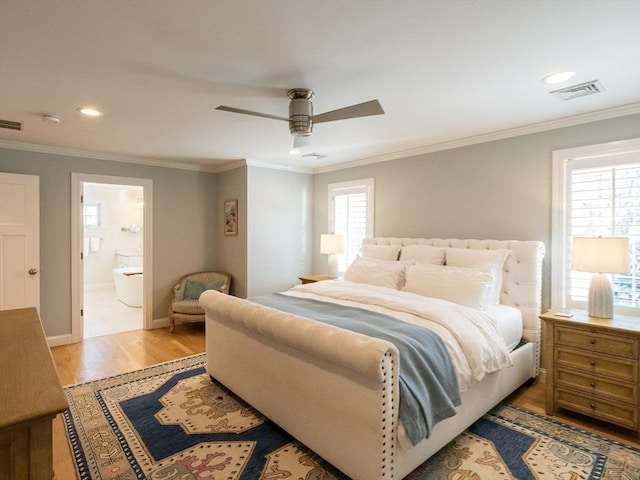 bedroom featuring ceiling fan, ornamental molding, hardwood / wood-style flooring, and ensuite bath