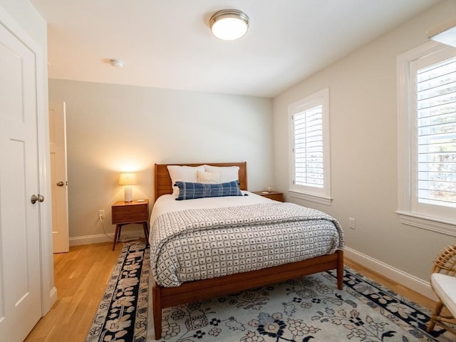 bedroom with light hardwood / wood-style floors