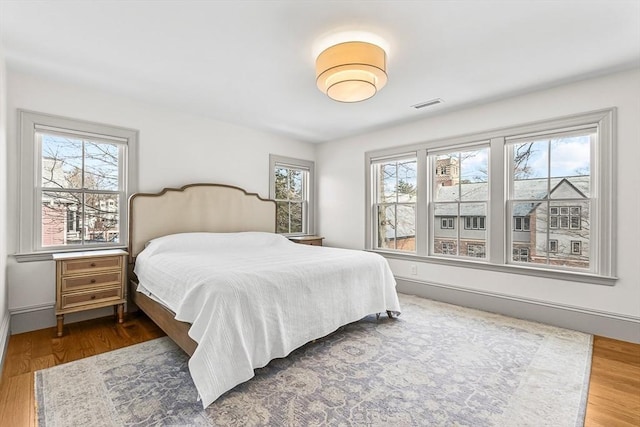 bedroom featuring wood-type flooring