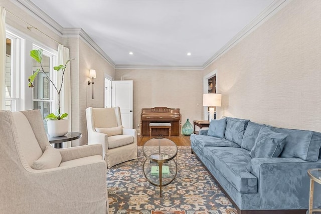 living room with hardwood / wood-style flooring and ornamental molding