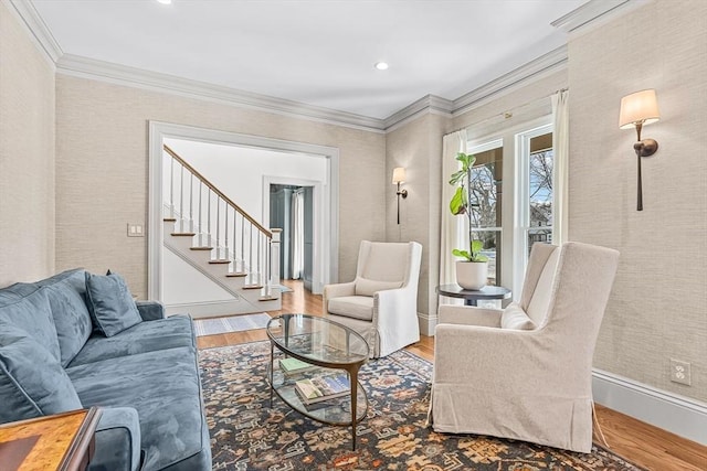 living room featuring hardwood / wood-style floors and crown molding