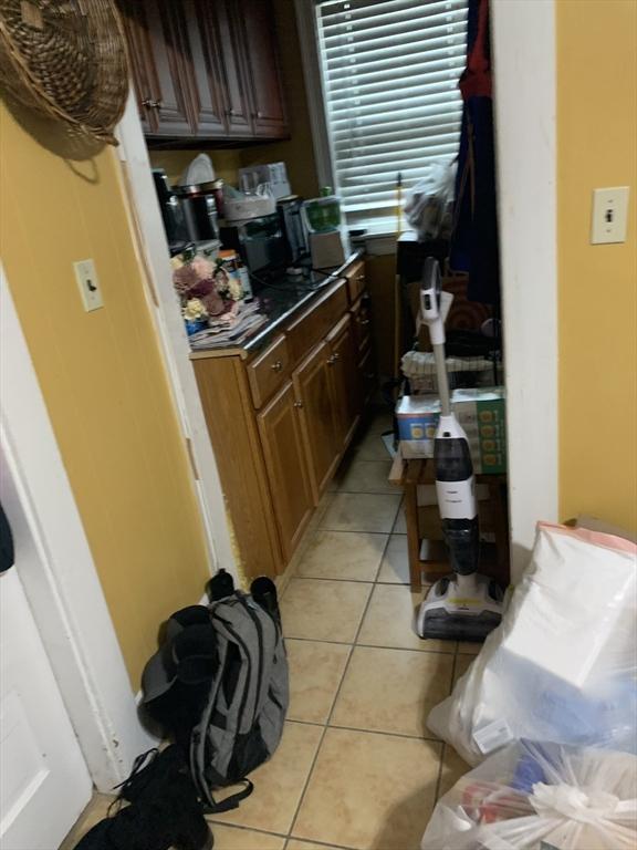 295 Grove St, Brockton, MA 02302 - kitchen with light tile patterned flooring