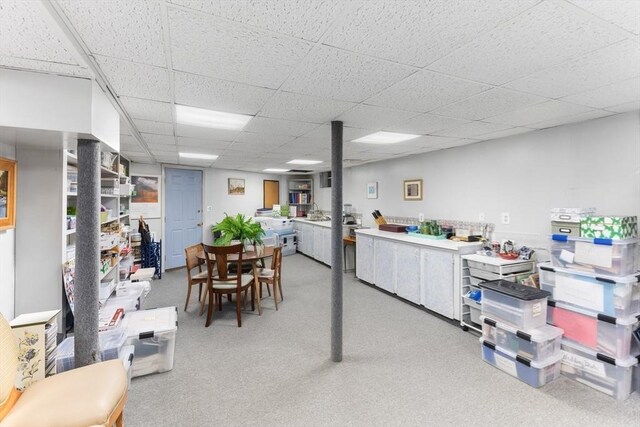 dining room featuring a drop ceiling