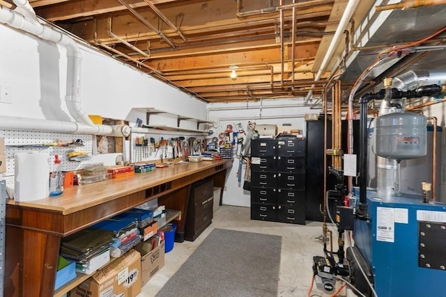 unfinished below grade area featuring a workshop area