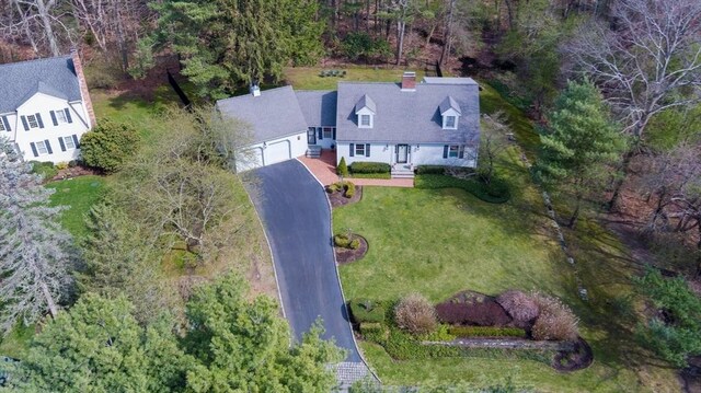 drone / aerial view with a wooded view
