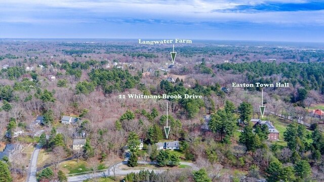 drone / aerial view featuring a view of trees