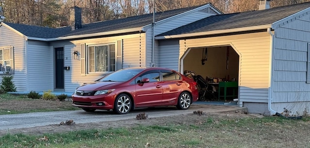 view of side of home with a garage