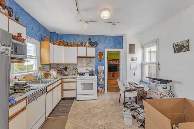 419 Poplar St, Boston, MA 02131 - kitchen with appliances with stainless steel finishes, white cabinetry, light countertops, light flooring, and wallpapered walls