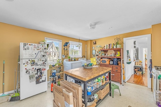 419 Poplar St, Boston, MA 02131 - kitchen with freestanding refrigerator and washing machine and clothes dryer