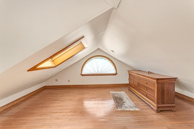 419 Poplar St, Boston, MA 02131 - bonus room with a skylight, lofted ceiling, and light wood-style flooring