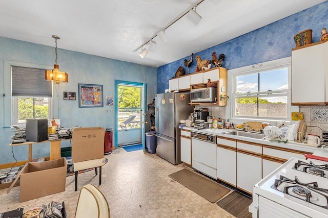 419 Poplar St, Boston, MA 02131 - kitchen with white appliances, white cabinetry, light countertops, and tasteful backsplash