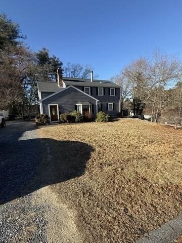 exterior space featuring a chimney