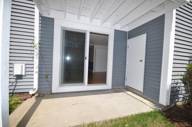 entrance to property featuring a patio