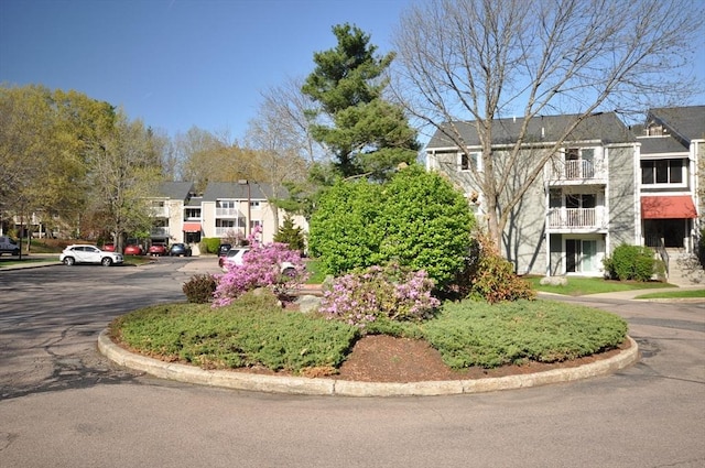 exterior space with a residential view and curbs