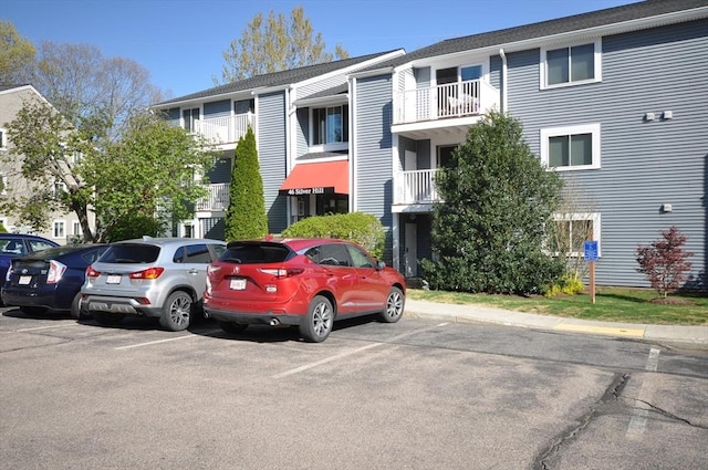 view of property with uncovered parking