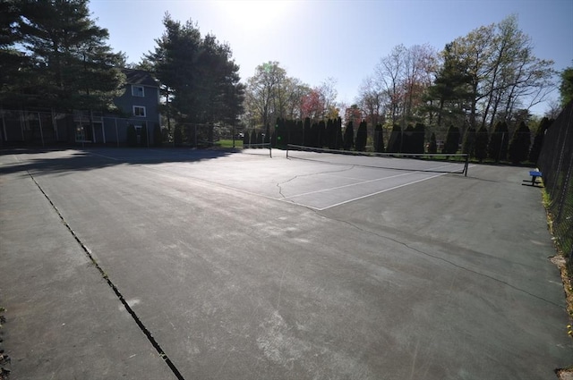 view of sport court with fence