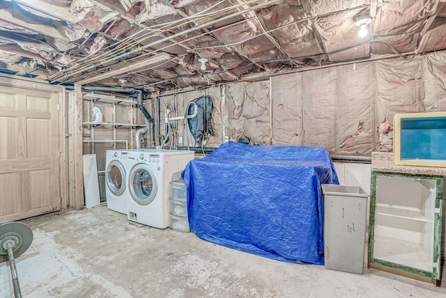 clothes washing area featuring independent washer and dryer