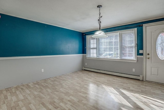 foyer with light wood-type flooring and a baseboard radiator