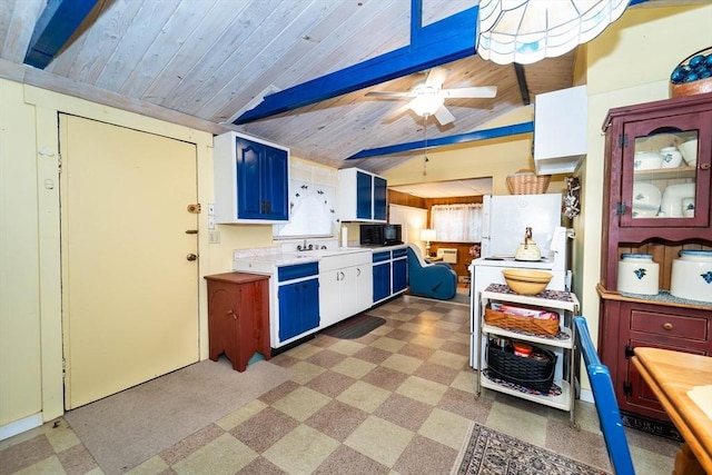 kitchen with vaulted ceiling with beams, sink, white refrigerator, ceiling fan, and wooden ceiling