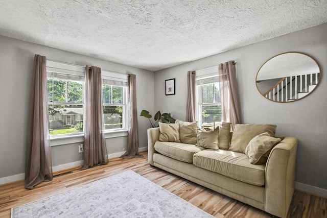 66 Squantum Rd, Jaffrey, NH 03452 - living room featuring a textured ceiling and wood finished floors