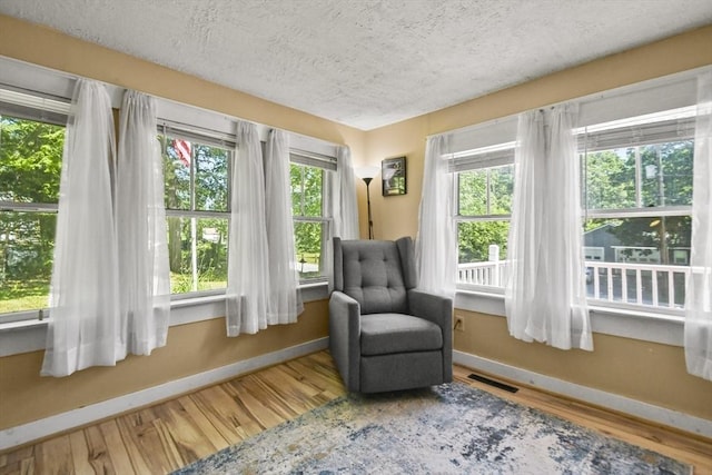 66 Squantum Rd, Jaffrey, NH 03452 - living area featuring a textured ceiling and wood finished floors