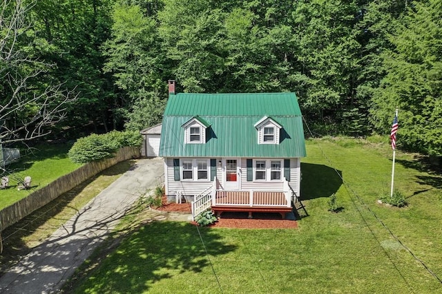 66 Squantum Rd, Jaffrey, NH 03452 - view of front of home featuring a chimney, an outdoor structure, a front lawn, a metal roof, and a garage