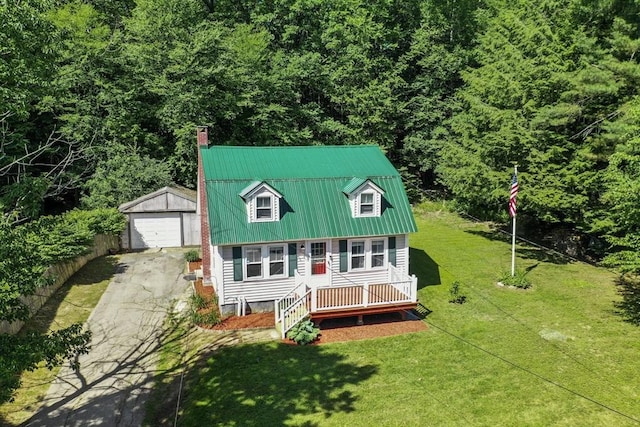 66 Squantum Rd, Jaffrey, NH 03452 - view of front of home featuring a chimney, an outdoor structure, driveway, a detached garage, and a metal roof