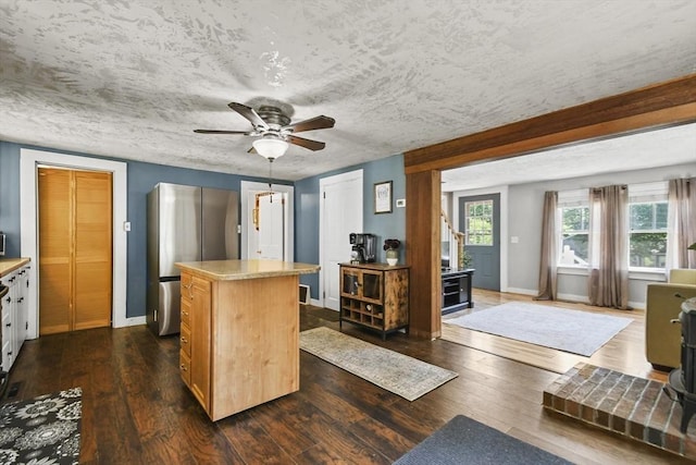 66 Squantum Rd, Jaffrey, NH 03452 - kitchen featuring a kitchen island, freestanding refrigerator, dark wood-style floors, and ceiling fan