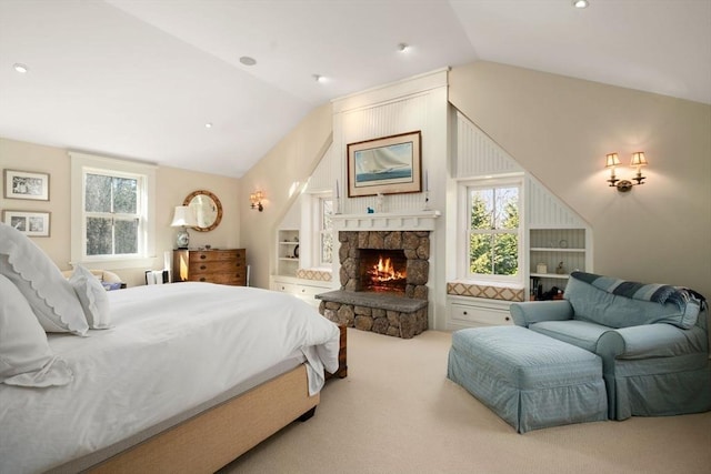 carpeted bedroom with recessed lighting, a fireplace, and vaulted ceiling