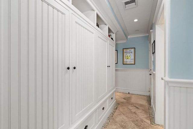 mudroom with recessed lighting, visible vents, ornamental molding, and wainscoting